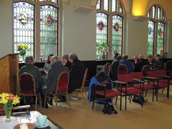 Delegates in their small groups discussing their rituals